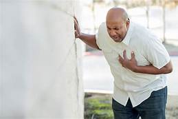 Man holding his chest image